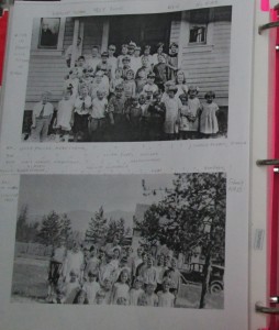 Two black and white photographs in a binder